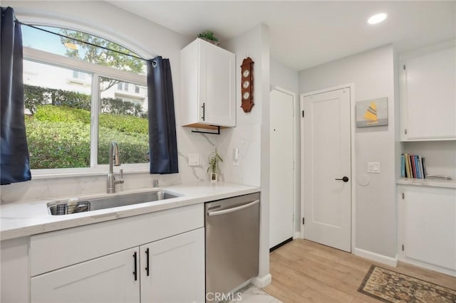 30902 Clubhouse Dr Unit 27D, Laguna Niguel, CA 92677 - kitchen featuring dishwasher, light wood-type flooring, white cabinetry, recessed lighting, and light stone countertops