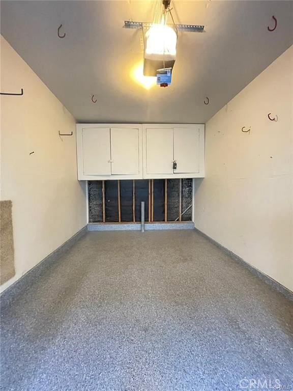 30902 Clubhouse Dr Unit 27D, Laguna Niguel, CA 92677 - garage featuring baseboards