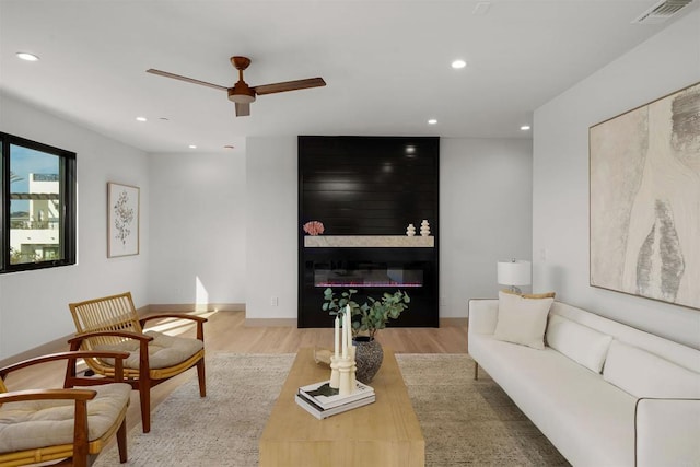164 Cherry Ave, Carlsbad, CA 92008 - living area featuring ceiling fan, wood finished floors, recessed lighting, and a glass covered fireplace