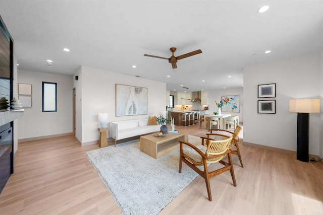 164 Cherry Ave, Carlsbad, CA 92008 - living room with light wood-type flooring, ceiling fan, recessed lighting, and a glass covered fireplace