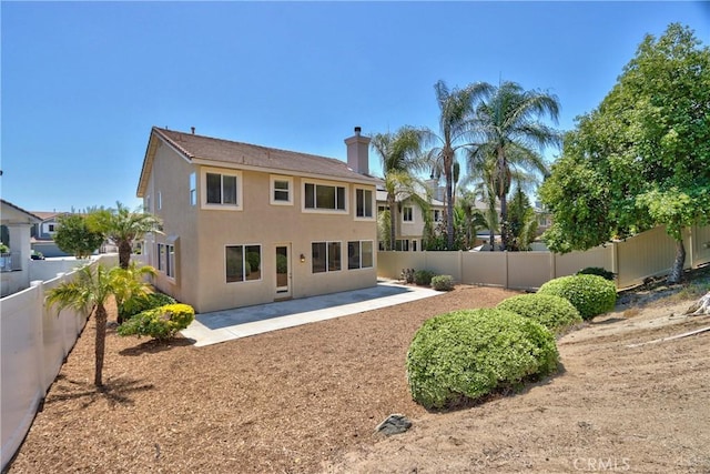 23794 Marin Ct, Murrieta, CA 92562 - rear view of house featuring a patio area, a fenced backyard, a chimney, and stucco siding