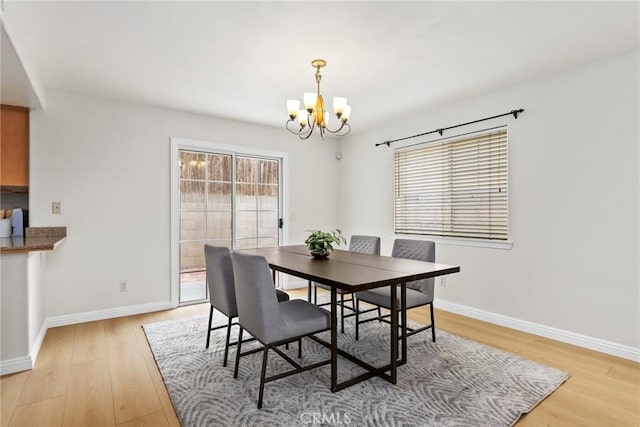 609 E Newmark Ave, Monterey Park, CA 91755 - dining space with a chandelier, light wood-style floors, and plenty of natural light