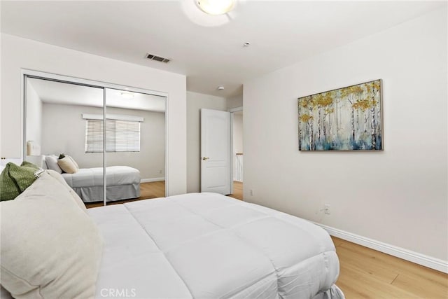 609 E Newmark Ave, Monterey Park, CA 91755 - bedroom featuring wood finished floors and a closet