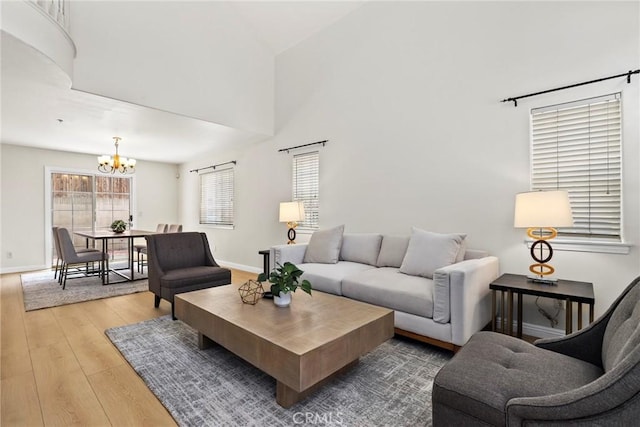 609 E Newmark Ave, Monterey Park, CA 91755 - living area with a chandelier, wood finished floors, and a towering ceiling