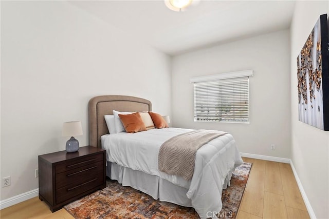609 E Newmark Ave, Monterey Park, CA 91755 - bedroom featuring light wood-style flooring and baseboards