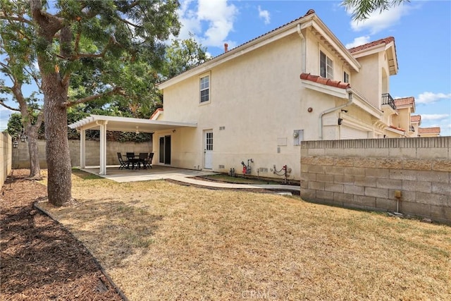 609 E Newmark Ave, Monterey Park, CA 91755 - rear view of property with stucco siding, a patio area, and a fenced backyard