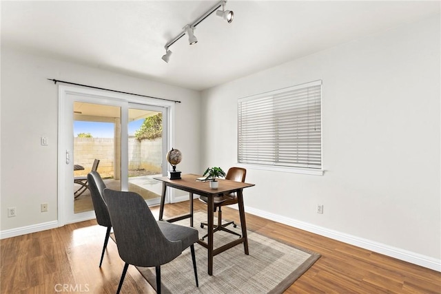 609 E Newmark Ave, Monterey Park, CA 91755 - dining space featuring rail lighting and wood finished floors