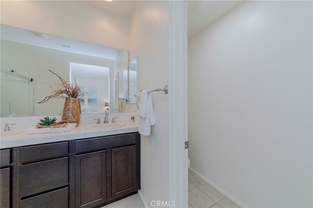 10410 Orchid Way, Santa Fe Springs, CA 90670 - bathroom with double vanity and tile patterned flooring