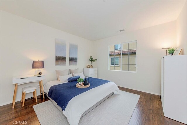 10410 Orchid Way, Santa Fe Springs, CA 90670 - bedroom with wood finished floors and freestanding refrigerator