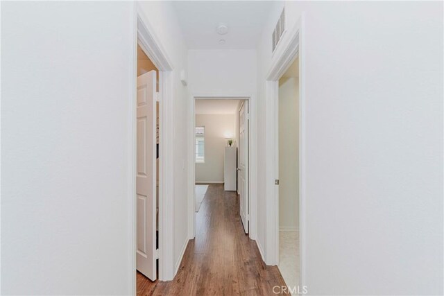 10410 Orchid Way, Santa Fe Springs, CA 90670 - hall featuring wood finished floors and baseboards