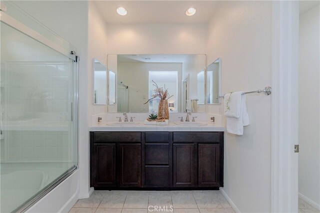 10410 Orchid Way, Santa Fe Springs, CA 90670 - full bath featuring double vanity, tile patterned flooring, enclosed tub / shower combo, and recessed lighting