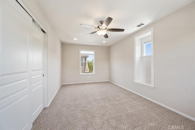 11506 Cuervo Way, Atascadero, CA 93422 - unfurnished bedroom with multiple windows, baseboards, light colored carpet, and recessed lighting