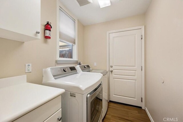 11506 Cuervo Way, Atascadero, CA 93422 - laundry area featuring cabinet space, washing machine and dryer, wood finished floors, and baseboards