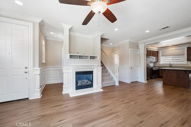 11506 Cuervo Way, Atascadero, CA 93422 - unfurnished living room featuring a decorative wall, a ceiling fan, light wood finished floors, recessed lighting, and crown molding