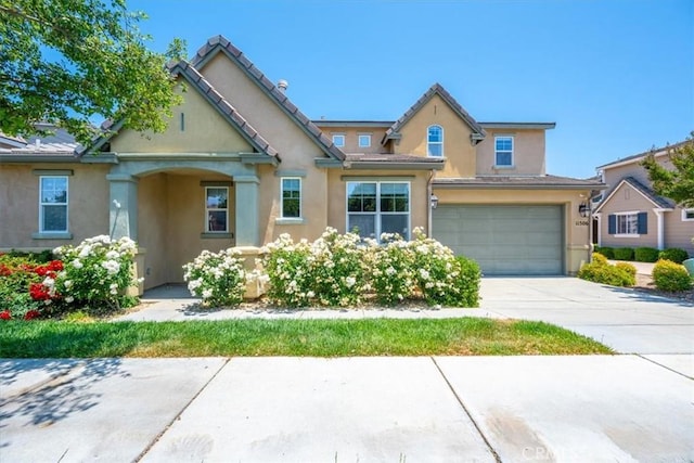 11506 Cuervo Way, Atascadero, CA 93422 - view of front facade with stucco siding, a garage, and driveway