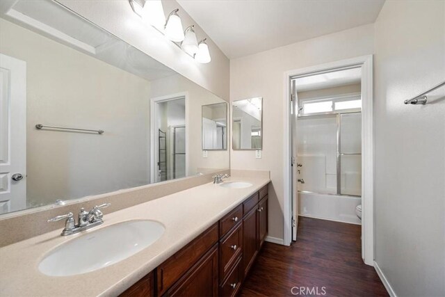 11506 Cuervo Way, Atascadero, CA 93422 - full bath with wood finished floors, double vanity, toilet, baseboards, and tub / shower combination