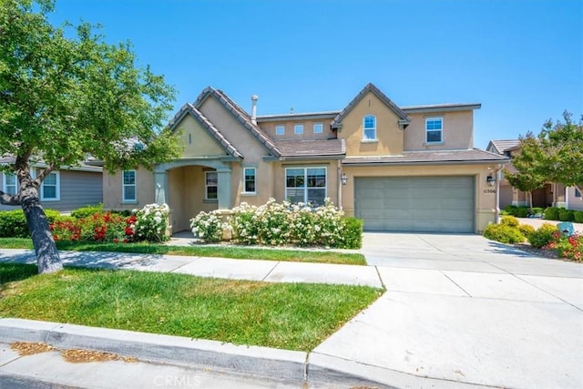 11506 Cuervo Way, Atascadero, CA 93422 - view of front of property with stucco siding, an attached garage, driveway, and a front yard