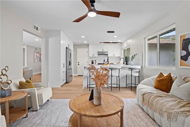 2014 Cumberland Rd, Glendora, CA 91741 - living area featuring light wood-type flooring, ceiling fan, and recessed lighting