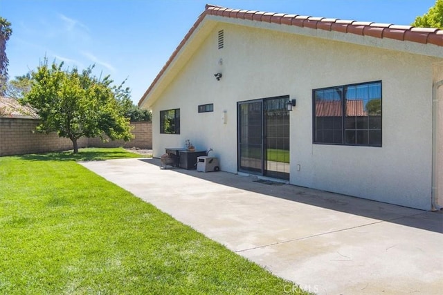 312 Crystal Cir, Lompoc, CA 93436 - rear view of property with stucco siding and a patio area
