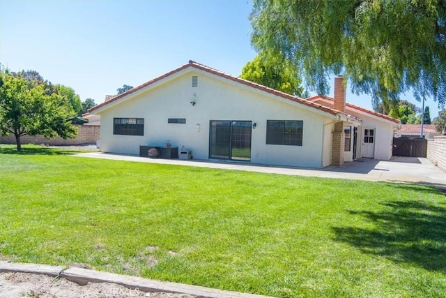 312 Crystal Cir, Lompoc, CA 93436 - rear view of house featuring a chimney, stucco siding, and a patio area