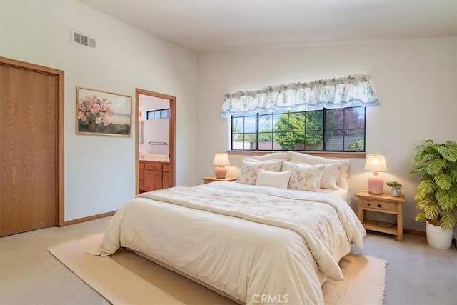 312 Crystal Cir, Lompoc, CA 93436 - bedroom with carpet flooring, connected bathroom, and baseboards