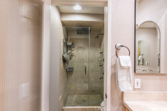 25847 Mcbean Pkwy Unit 25, Valencia, CA 91355 - bathroom with a shower stall, vanity, and toilet