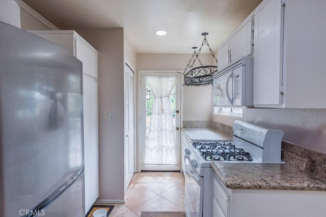25847 Mcbean Pkwy Unit 25, Valencia, CA 91355 - kitchen with white appliances, white cabinetry, light tile patterned flooring, recessed lighting, and baseboards