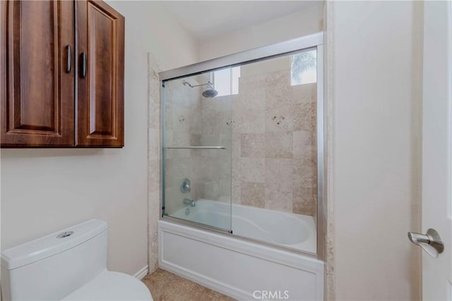 211 Franklin Ave, Redlands, CA 92373 - bathroom featuring toilet, bath / shower combo with glass door, and baseboards