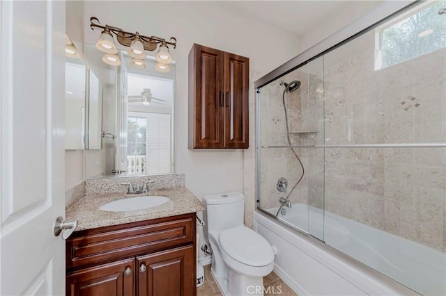 211 Franklin Ave, Redlands, CA 92373 - full bathroom with vanity, toilet, bath / shower combo with glass door, and plenty of natural light