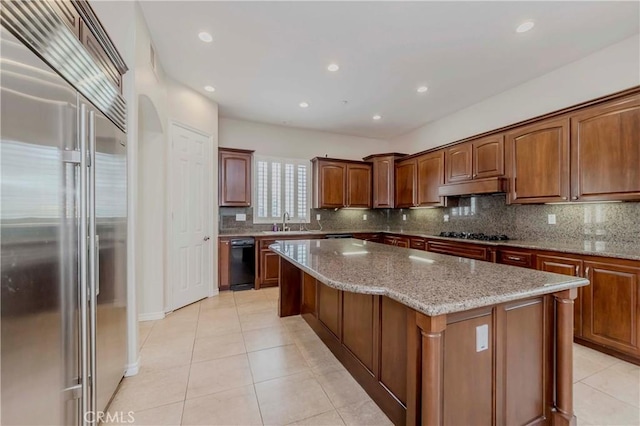211 Franklin Ave, Redlands, CA 92373 - kitchen featuring built in fridge, light tile patterned flooring, backsplash, a center island, and recessed lighting