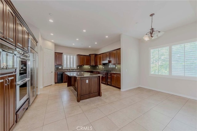 211 Franklin Ave, Redlands, CA 92373 - kitchen featuring a chandelier, backsplash, a sink, light tile patterned flooring, and recessed lighting