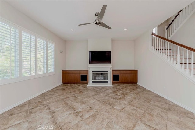 211 Franklin Ave, Redlands, CA 92373 - unfurnished living room with ceiling fan, a glass covered fireplace, baseboards, stairway, and recessed lighting
