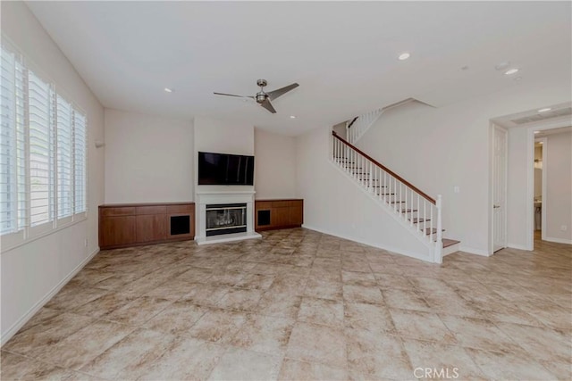 211 Franklin Ave, Redlands, CA 92373 - unfurnished living room featuring stairs, ceiling fan, a glass covered fireplace, recessed lighting, and baseboards