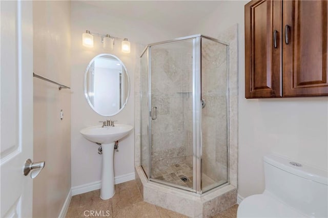 211 Franklin Ave, Redlands, CA 92373 - bathroom featuring toilet, a shower stall, tile patterned floors, and baseboards