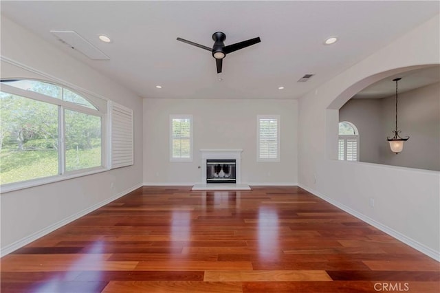 211 Franklin Ave, Redlands, CA 92373 - unfurnished living room with ceiling fan, wood finished floors, a glass covered fireplace, recessed lighting, and baseboards