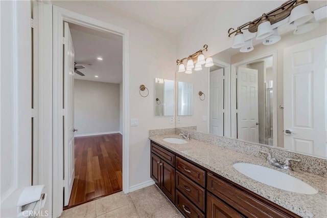 211 Franklin Ave, Redlands, CA 92373 - bathroom featuring double vanity, baseboards, and tile patterned flooring