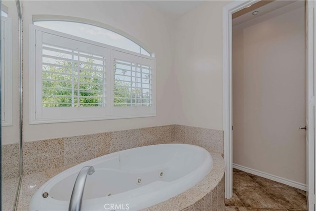 211 Franklin Ave, Redlands, CA 92373 - bathroom featuring a whirlpool tub and tile patterned flooring