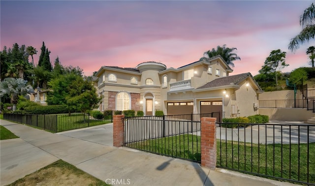 211 Franklin Ave, Redlands, CA 92373 - mediterranean / spanish-style home featuring a balcony, stucco siding, an attached garage, and concrete driveway