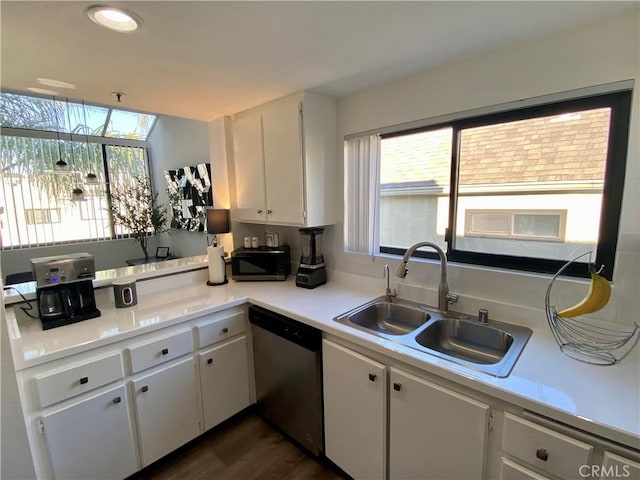 17722 Sergio Cir Unit 203, Huntington Beach, CA 92647 - kitchen featuring dishwasher, a sink, black microwave, white cabinets, and light countertops