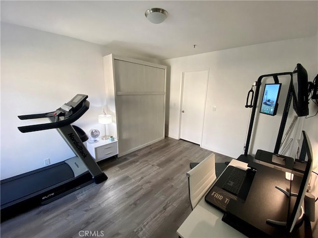 17722 Sergio Cir Unit 203, Huntington Beach, CA 92647 - workout room with dark wood finished floors