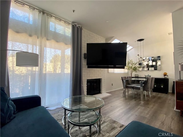 17722 Sergio Cir Unit 203, Huntington Beach, CA 92647 - living area with wood finished floors and a fireplace