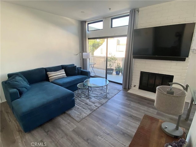 17722 Sergio Cir Unit 203, Huntington Beach, CA 92647 - living room with wood finished floors and a fireplace