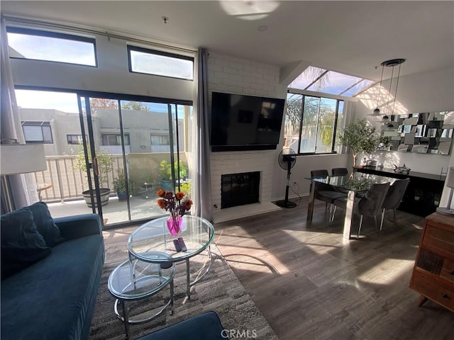 17722 Sergio Cir Unit 203, Huntington Beach, CA 92647 - living area with wood finished floors and a fireplace
