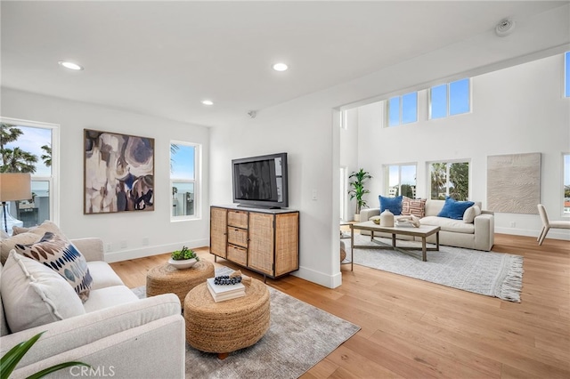 200 S Catalina Ave Unit 403, Redondo Beach, CA 90277 - living area with plenty of natural light, recessed lighting, baseboards, and light wood-style floors