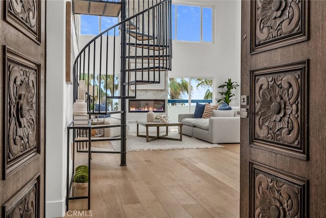 200 S Catalina Ave Unit 403, Redondo Beach, CA 90277 - foyer featuring a high ceiling, wood-type flooring, healthy amount of natural light, and stairway