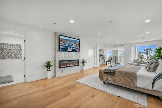 200 S Catalina Ave Unit 403, Redondo Beach, CA 90277 - living area featuring wood finished floors, a high end fireplace, and recessed lighting