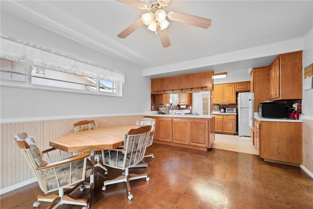 1426 E Colver Pl, Covina, CA 91724 - dining room featuring wainscoting, a ceiling fan, and wood finished floors