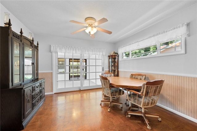 1426 E Colver Pl, Covina, CA 91724 - dining room with wainscoting, a ceiling fan, wood walls, and wood finished floors