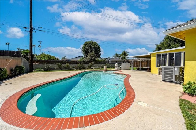 1426 E Colver Pl, Covina, CA 91724 - view of swimming pool featuring central air condition unit, a patio, and a fenced backyard