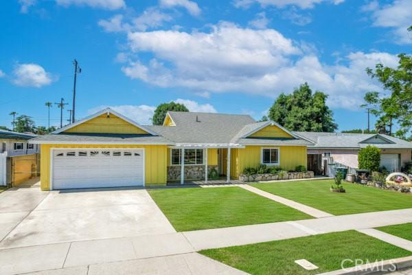1426 E Colver Pl, Covina, CA 91724 - ranch-style home with an attached garage, concrete driveway, and board and batten siding